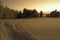 Sunset over snowy countryside