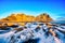 Sunset over the Stokksnes Mountain on Vestrahorn Cape with Snow in Iceland