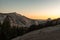 Sunset over the stone hills next to Olmsted Viewpoint in Yosemite National Park at sunset