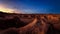 Sunset over strange desert canyon landscape