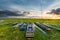 Sunset over swamp with colorful wooden old boats