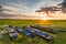 Sunset over swamp with wooden old boats