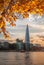 Sunset over Thames with modern skyscrapers in London, England