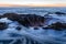 Sunset over Thor`s Well sunset, a natural sinkhole at Cape Perpetua, Oregon Coast.