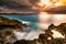 Sunset over a tropical rocky beach