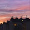 Sunset over urban rooftops