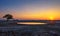 Sunset over the waterhole of Okaukuejo Camp in Etosha, Namibia