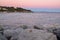 Sunset over winter Ligurian Sea beach. Color image