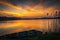 Sunset over the Zemborzycki Reservoir in Poland, boats and water reflections