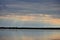 Sunset through overcast skies over Shawano Lake in Wisconsin