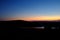 Sunset overlooking Cadillac Mountain in Maine with traffic streaking past