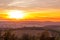 Sunset overlooking nature and landscape from Brno hill sunset couple of moments before sunset orange color with clouds moving in