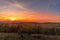 Sunset overlooking nature and landscape from Brno hill sunset couple of moments before sunset orange color with clouds moving in