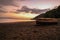 sunset overlooking a tropical jungle beach