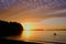 Sunset paddle.  Lone kayaker heads out to enjoy setting sun