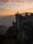 Sunset panorama hiker poncho on Marcahuasi andes plateau rock formations mountain hill valley nature landscape Lima Peru