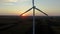 Sunset panorama from a large wind farm in the middle of a large field