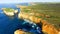 Sunset panoramic aerial view of Loch Ard Gorge and Island Arch,