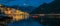 Sunset panoramic view of Kotor Bay and the lights in the postcard perfect town of Perast, Montenegro, long exposure