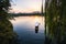 Sunset panoramic view of the West Lake in Hangzhou, China. Beautiful silhouette in sunrise colors