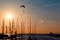 Sunset paragliding over yachts