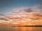 Sunset on Pensacola Bay with Blue Sky and Orange Clouds