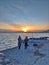 Sunset people lake Armenia winter cold