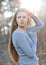 Sunset portrait of a pretty calm young woman