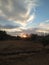 Sunset in Portugal with mysterious clouds and ancient fence