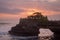 Sunset at Pura Batu Bolong temple on the beatiful rock in Bali