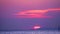 Sunset and purple cloud on sky over sea and surface little wave moving