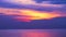 Sunset purple on red cloud moving down on sea and orange sky background