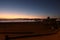 Sunset on the quiet beach of Los Cristianos with volcanic sand, Los Cristianos, Tenerife, Spain