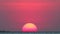 Sunset on red clear sky on light orange cloud on sea time lapse