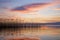 Sunset and reeds mirroring in the lake