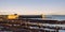 Sunset Reflecting off the harbour Walls of Old Saltcoats Pier on