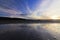 Sunset and reflecting sky on the beach surface of Red Wharf Bay, Isle of Anglesey, North Wales