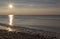 Sunset and reflection on beach at Barmouth