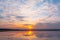 Sunset reflection lagoon. beautiful sunset behind the clouds and blue sky above the over lagoon landscape background. dramatic sky