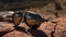 Sunset reflection on sunglasses, nature elegance generated by AI