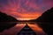 Sunset reflections, old canoe, Calm lake