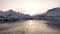 Sunset reflections of snow covered mountains near Svolvaer on the Lofoten in Norway