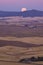 Sunset and rising full moon from Steptoe Butte, Palouse Valley,