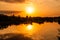 Sunset on the river Berezina with the reflection of the sun in the water