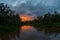 Sunset on the river in the Bornean forest