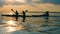 Sunset river with people crossing it on kayaks