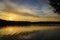 Sunset river water reflection landscape. River sunset reflection. Sunset river landscape. Sunset orange river view