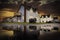 Sunset road puddle reflection of rustic beach homes on the Avalon peninsula