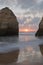 Sunset between rocks cliffs on beautiful sandy beach in algarve