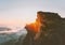 Sunset rocky mountains over clouds landscape in Norway